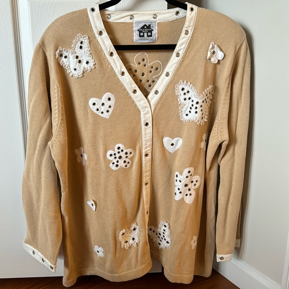 Tan storybook knit sweater with white hearts and flowers
